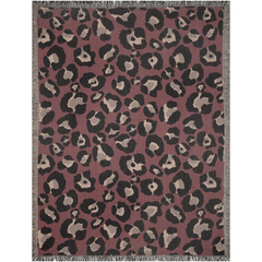 Bold burgundy woven throw blanket featuring leopard print with fringed edges, perfect for stylish decor.