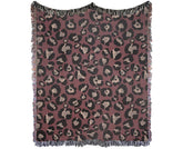Maximalist bold animal print woven throw blanket in burgundy tones