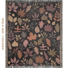 Decorative autumn tapestry throw blanket with leaf pattern on a dark background