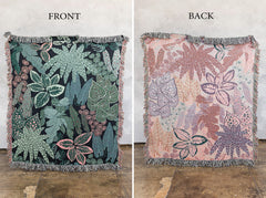 Person hanging tropical botanical wall tapestry showing scale and size in room