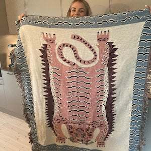 50x60 inch tiger blanket held by a women