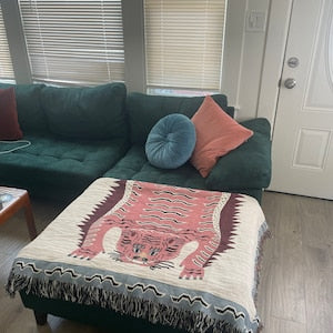 Folded tiger throw on ottoman chair