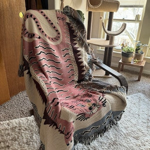 Cozy corner with tiger blanket and cushions