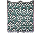 Bohemian Ikat Throw Blanket with multicolor fringed edges and vintage pattern.