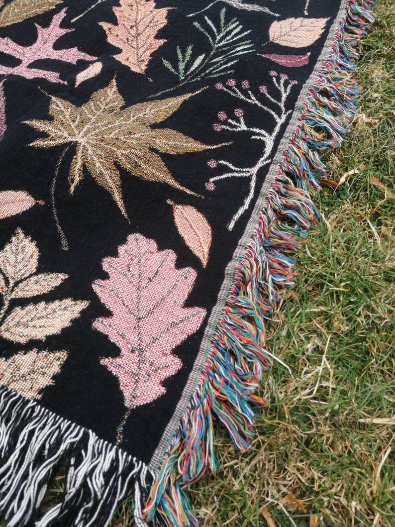 Fringed cotton fall autumn taprstry blanket throw blanket on dark background
