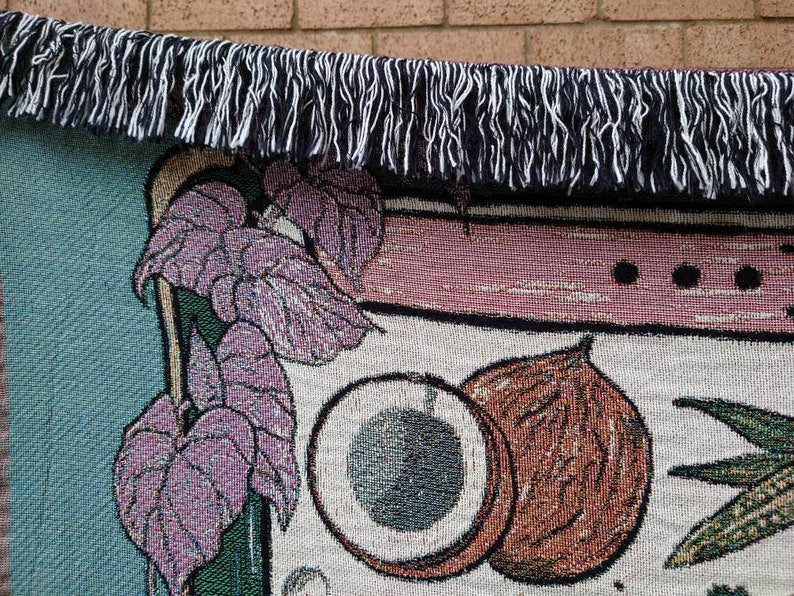 Close-up of Vegan Af throw blanket showing soft cotton texture and fringe edges