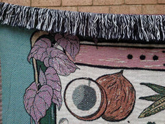 Close-up of Vegan Af throw blanket showing soft cotton texture and fringe edges