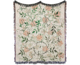 William Morris Tapestry Blanket featuring beautiful Jasmine artwork with orange flowers and green leaves, fringed edges.