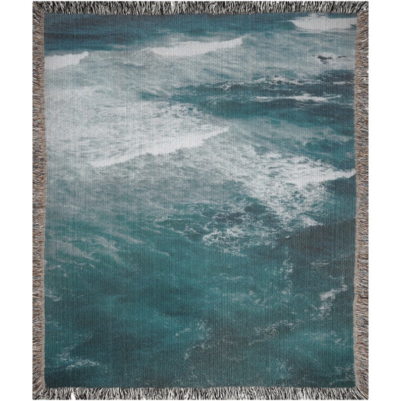 Ocean Waves Throw Blanket styled on a bed – modern coastal bedroom look