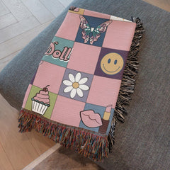 Folded dollcore woven blanket showing self love and positive vibes design