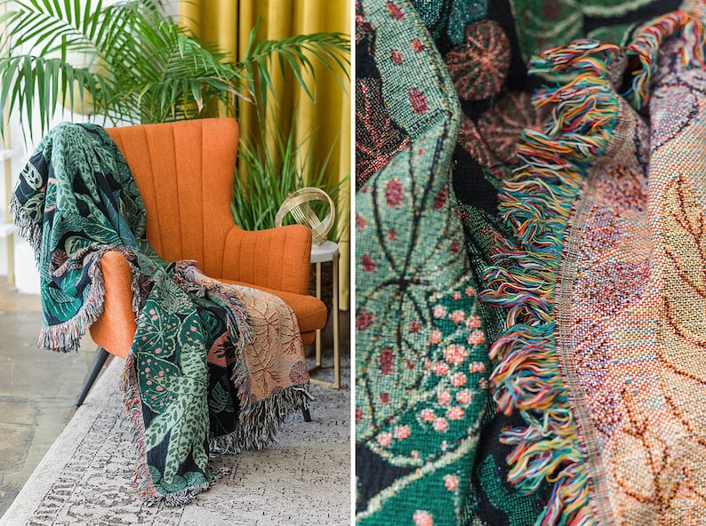 Large botanical woven blanket tapestry hanging above modern sofa in boho living room
