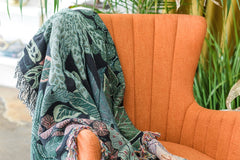 Botanical woven blanket with fringe on all four edges