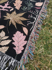 Fringed cotton fall autumn taprstry blanket throw blanket on dark background